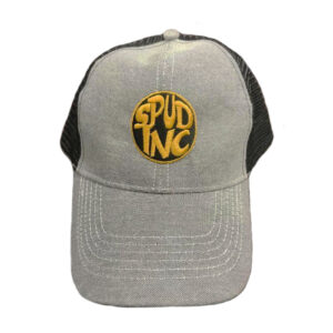 A gray baseball cap with a black mesh back features a yellow circular patch on the front, boldly displaying the text SPUD INC.