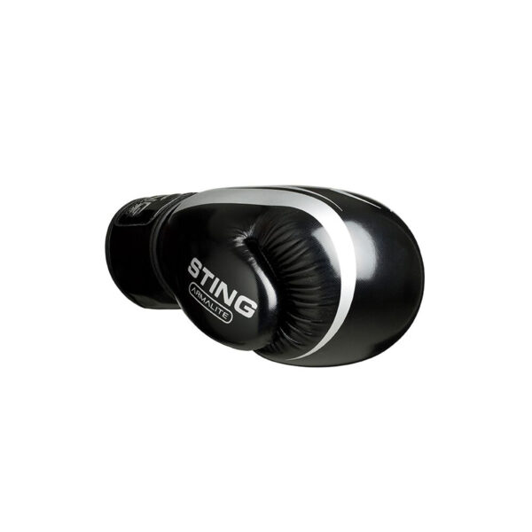 A sleek, shiny Sting Armalite Boxing Glove in black and white, with STING boldly written on it, is angled to display its side.