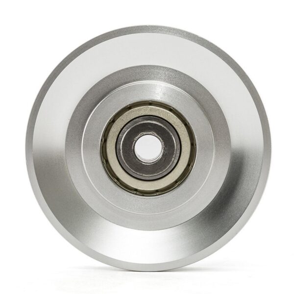 Close-up of a shiny, silver-toned Aluminium Pulley Wheel 115mm with concentric grooves. The darker center reveals the internal mechanism against a plain background.