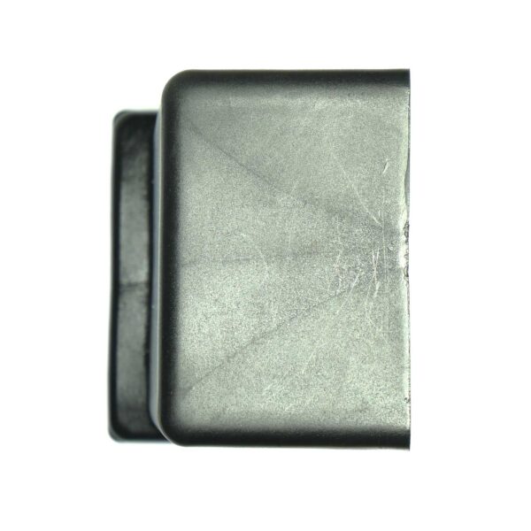 Close-up of a Rubber Foot 60mmx60mm, rectangular and slightly curved with visible scratches and a matte finish. The plain white background highlights its texture and shape.