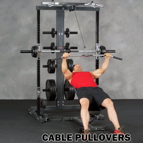 A person performs cable pullovers on a bench, arms extended, gripping the bar of an Ironmaster IM2000 Self-Spotting Smith Machine. Theyre wearing a red tank top and black shorts. Text reads Cable Pullovers.