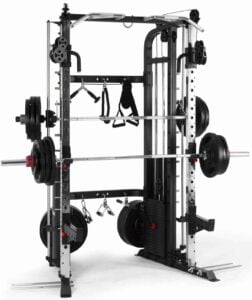 A weightlifting machine equipped with multiple bars, pulleys, and weights. It features a smith machine barbell and various attachments, suitable for a full-body workout. The setup includes weight plates on a rack for training versatility.