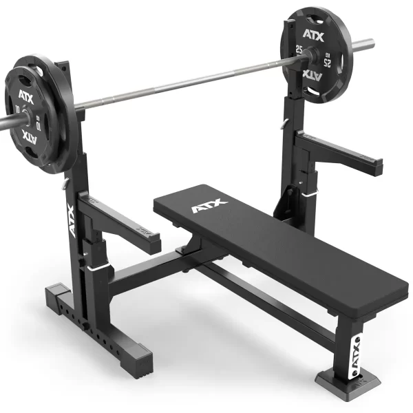 A black ATX® Olympic Bench Press 700 with a barbell and two weight plates on each side features adjustable supports for various workouts.