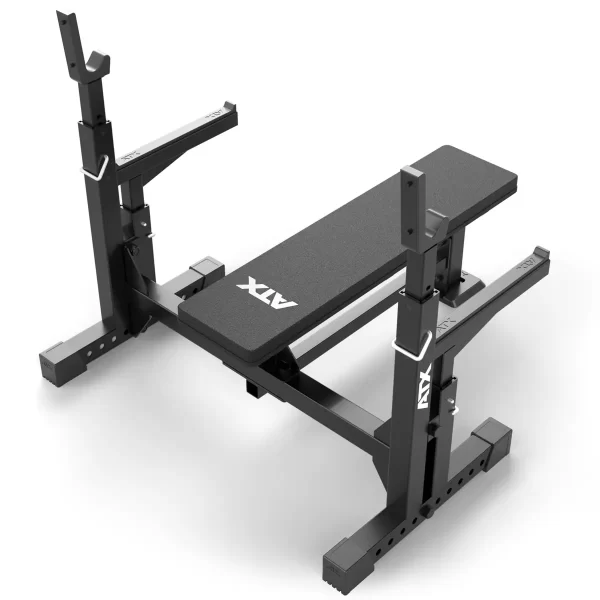 The ATX® Olympic Bench Press 700 is a black adjustable weight bench featuring ATX branding on the seat. It includes sturdy supports, barbell holders, and supportive legs, making it ideal for various strength training exercises.