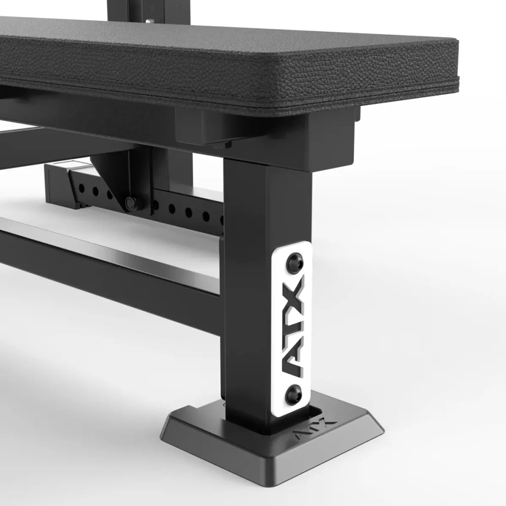 Close-up of a black rectangular leg from the ATX® Olympic Bench Press 700, featuring bolt holes for adjustability and displaying the ATX logo on a white background.