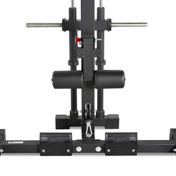 Close-up of a black ATX® Half Rack workout machine featuring padded rollers, footholds, and metal bars. Designed for lower body exercises like targeting hamstrings and glutes, with a red adjustment knob visible on the side.