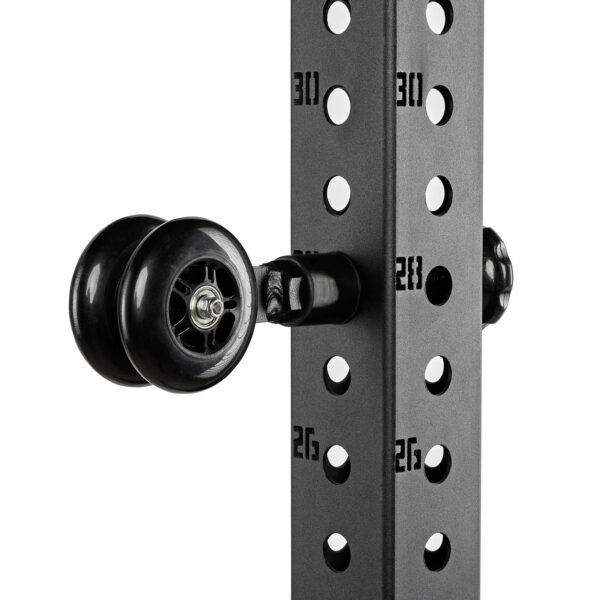Close-up of the ATX® Mobility Roller, featuring a black, minimalist pulley system with two wheels attached to a metal frame. The vertical column has numbered holes for adjustable heights, and numbers 26, 28, and 30 are visible.