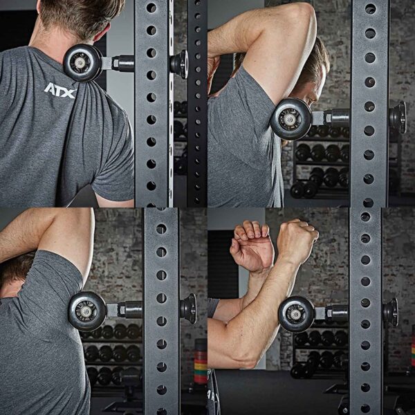 Using the ATX® Mobility Roller on a rack, a person demonstrates shoulder and upper body stretches in a gym. Theyre wearing a gray T-shirt, with weights visible in the background.