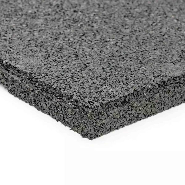 Close-up of the GymFloor RTS 50x50@20mm System, featuring its textured black rubber surface and thickness. The mat is shown on a white background, emphasizing its rugged material and slightly rough edges.