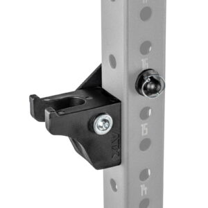 Close-up of the ATX® Bar Holder, a black metal bracket attached to a gray vertical pole with numbered holes, used in exercise equipment. It is secured with bolts and has a hook-like design for holding weights or accessories.