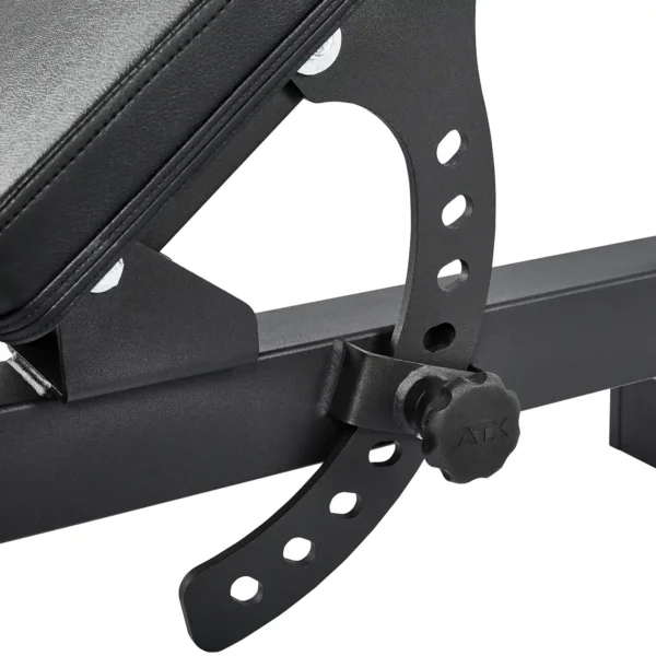 Close-up of a black folding fitness bench mechanism with multiple holes and a knob labeled ATX for adjusting the angle, showcasing the design and functionality for customizable workout settings.