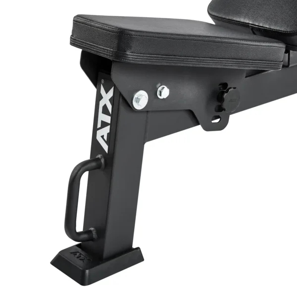Close-up of a black ATX folding fitness bench, showcasing part of the padded seat and sturdy metal frame with a side handle. The ATX logo is visible on the frame, highlighting the brands reputation for quality.