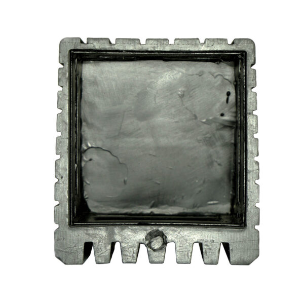 Close-up of the Rubber Foot 50mmx50mm, showcasing its square shape with a rough, textured metallic surface and notched edges, resembling an industrial component.