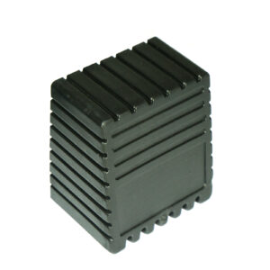 The Rubber Foot 50mmx50mm is a black, rectangular plastic object with ribbed edges, featuring a grooved design that resembles a heat sink or protective casing.