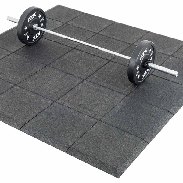 A barbell with weight plates is centrally positioned on a set of Shock & Sound Tile 30mm System gym mats. These interlocking, square rubber mats have a textured surface and offer cushioning for weightlifting or exercise.