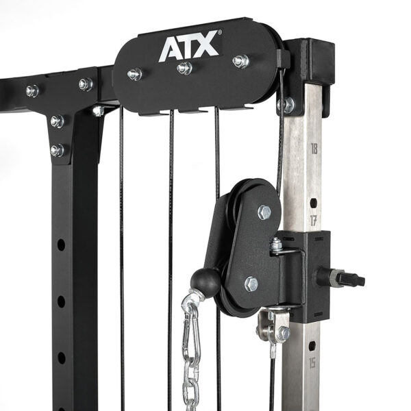 Close-up of a black ATX® Cable Crossover Weight Stack 90 kg on a gym machine. The image showcases metal components, bolts, and a chain, highlighting its sturdy construction and detailing.