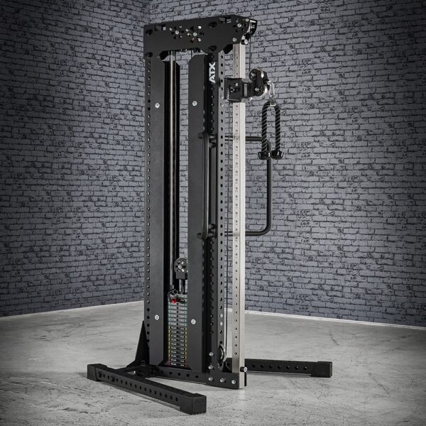 In a gray gym setting with a brick wall backdrop, a black and silver cable station stands ready for action. This versatile equipment is designed for strength training, featuring a weight stack and adjustable pulleys.