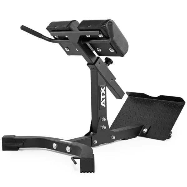 The ATX® Hyperextension Machine 650, a black adjustable bench also referred to as a Roman chair, comes with padded supports, a handle, and a footplate. Its sturdy frame prominently features the ATX® logo on the side.
