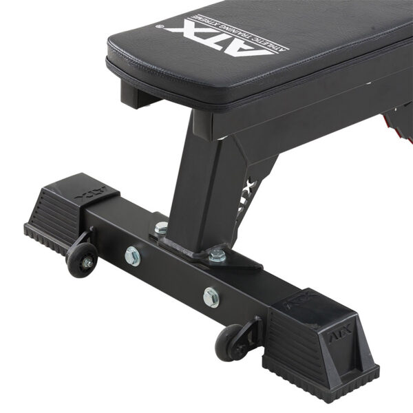 Close-up of the ATX® Utility Bulls Bench, featuring a sturdy black metal frame, rubber-padded feet, two small caster wheels, and a leather-covered seat with the brand logo visible on it.