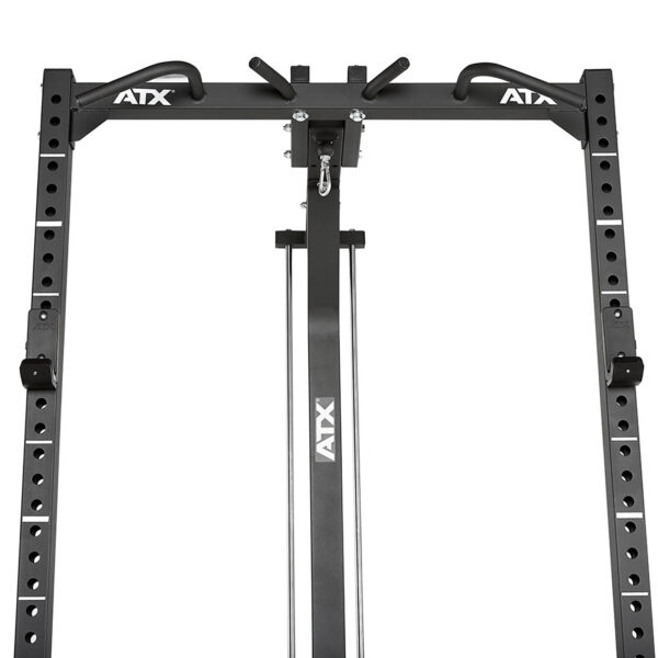 A close-up view of the top section of the ATX® HRX-620 Half Rack System Pin Loaded 115 kg shows multiple adjustable holes and pull-up bar attachments, with the ATX brand visible in white on the black metal frame.