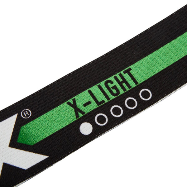 Close-up of a black and green ATX® Loop Band highlighting the text X-LIGHT and a star-like logo, with white circles visible near the text.