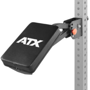 The ATX® The Bridge Supporting Pad is a black adjustable gym bench with padding, adjustment holes, and an orange adjustment knob, mounted on a gray metal support rack featuring the ATX logo.