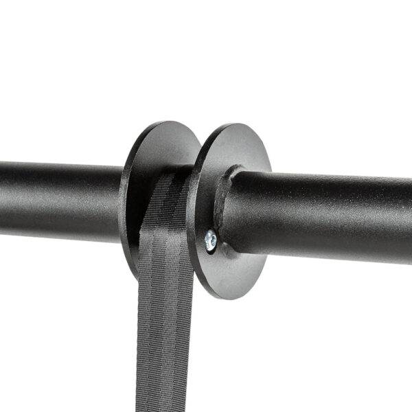 A close-up of a black wall-mounted belt stanchion, featuring a retractable black belt attached to a circular end piece, is secured with a visible screw on a plain white background. Note: This product is not the ATX® Forearm Training Set.