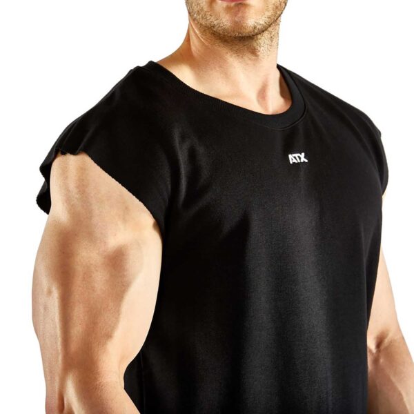 A muscular person in an ATX® Muscle Shirt showcases their well-defined arm against a plain white background.