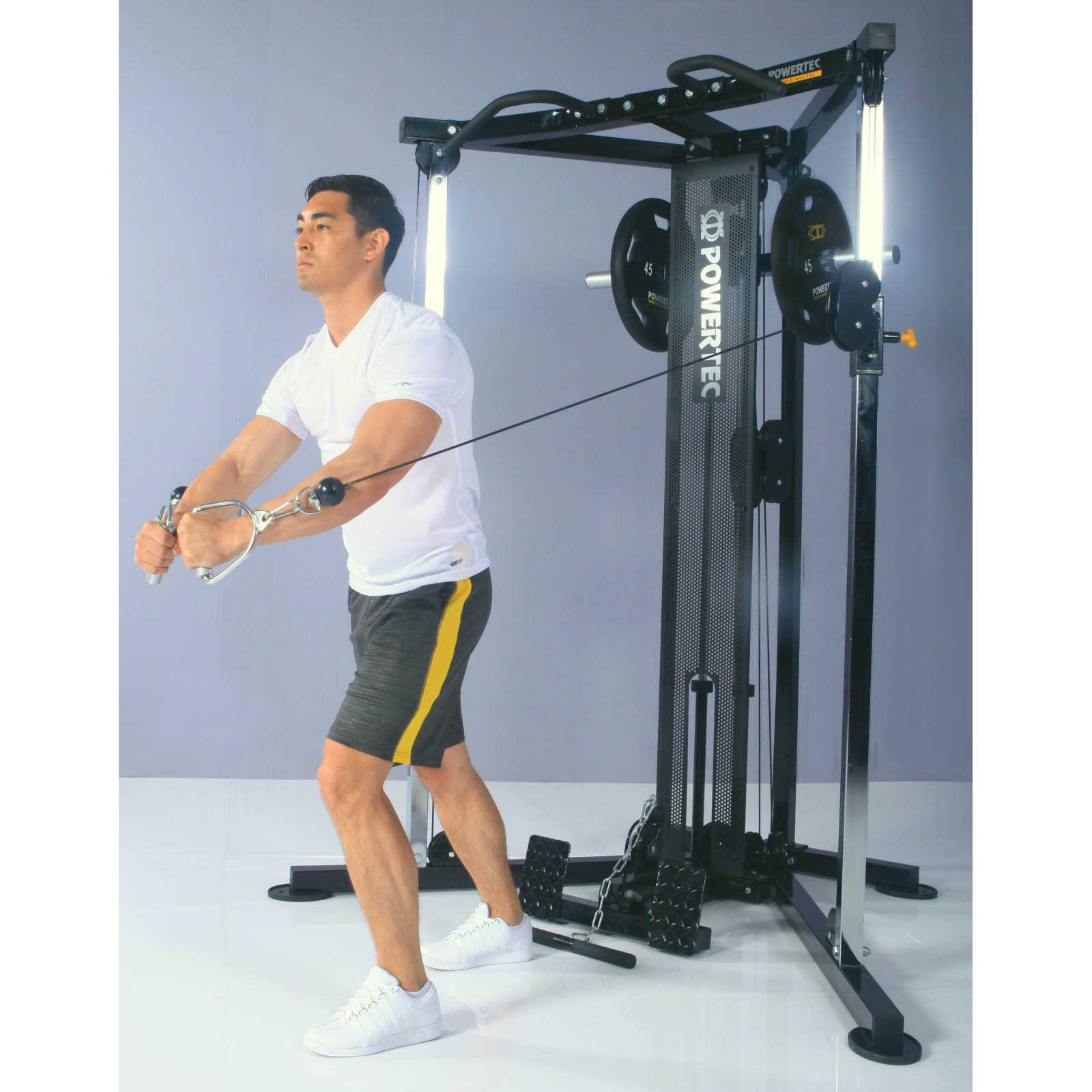A man doing cable crossovers on a functional trainer