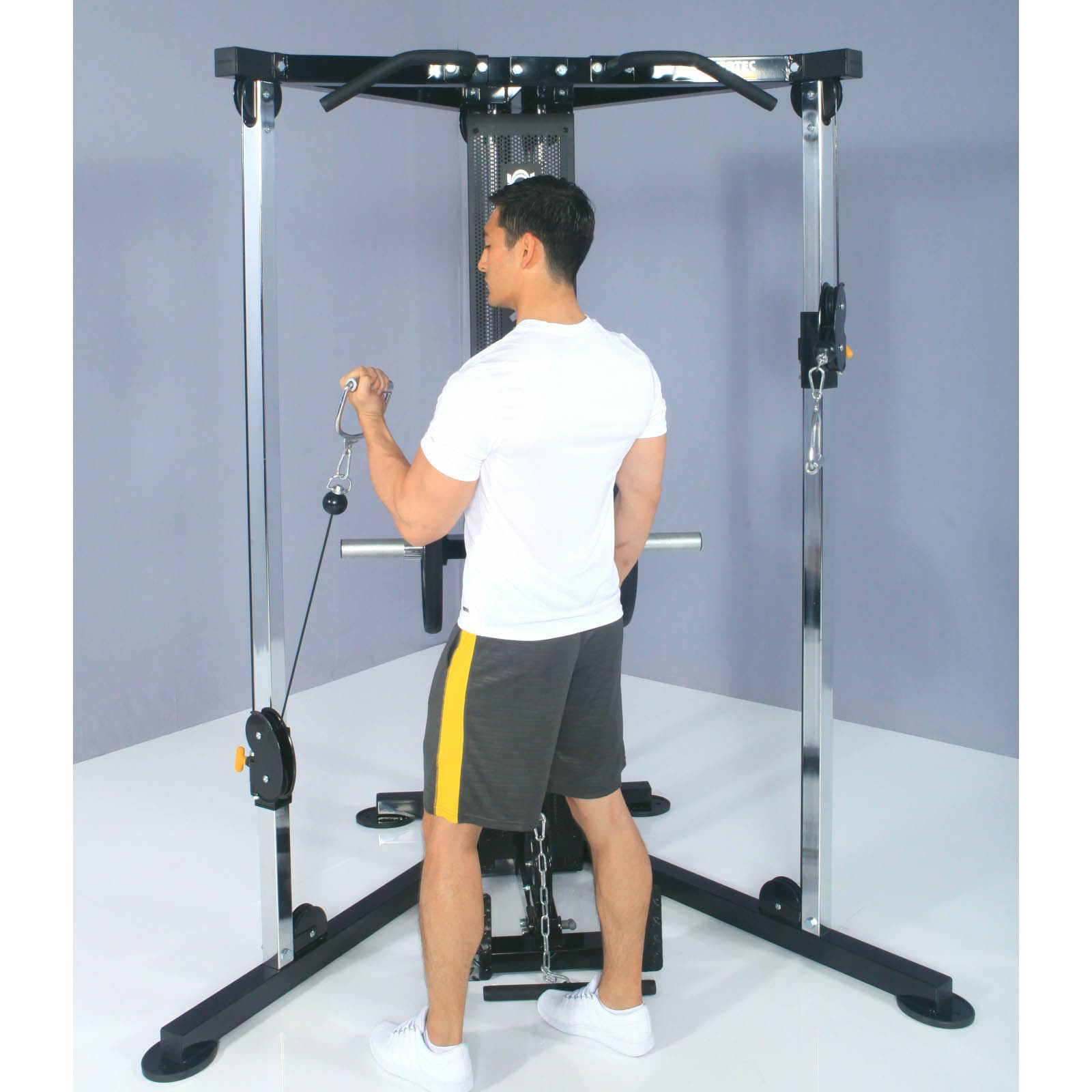 A man doing a one arm cable curl on a Functional Trainer