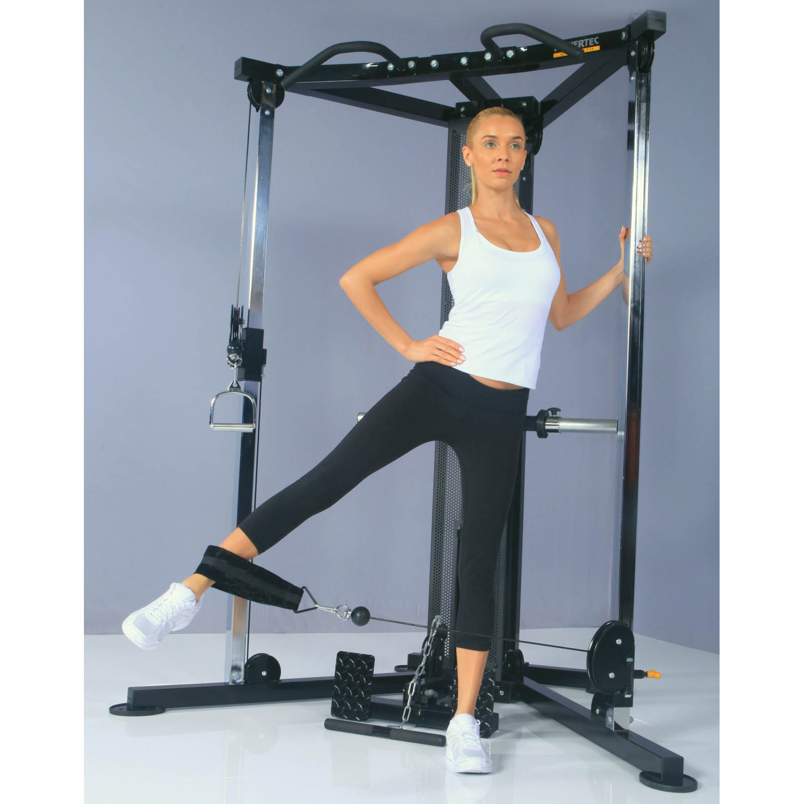 Woman doing leg exercise on a functional trainer