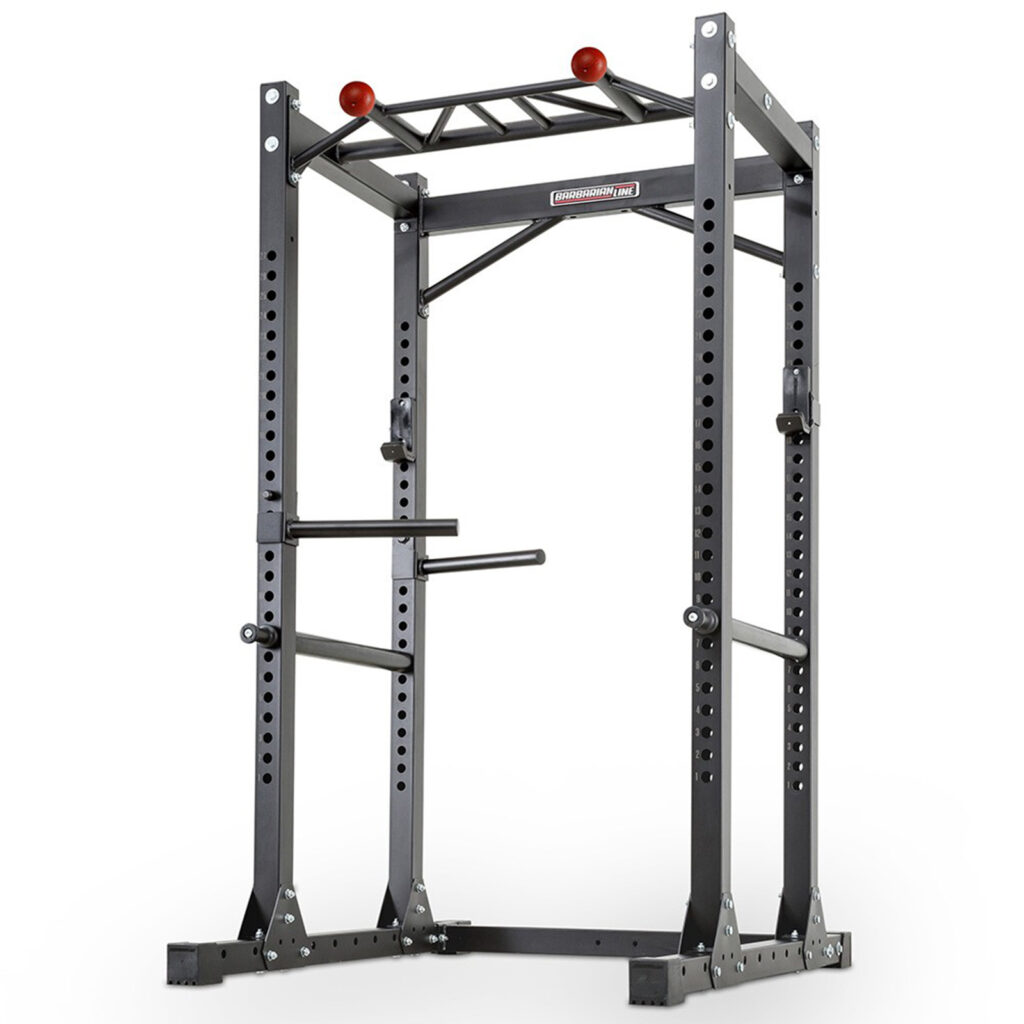 Introducing the Barbarian Commercial Power Cage: a black freestanding power rack with multiple adjustment holes, pull-up bars, and dip handles. Perfect for strength training exercises like squats and bench presses, it boasts a sturdy, industrial design built to withstand intense workouts.