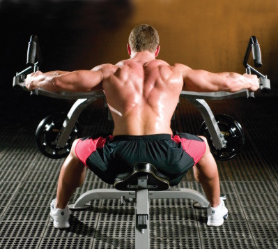 man doing leverage rear delt exercise.