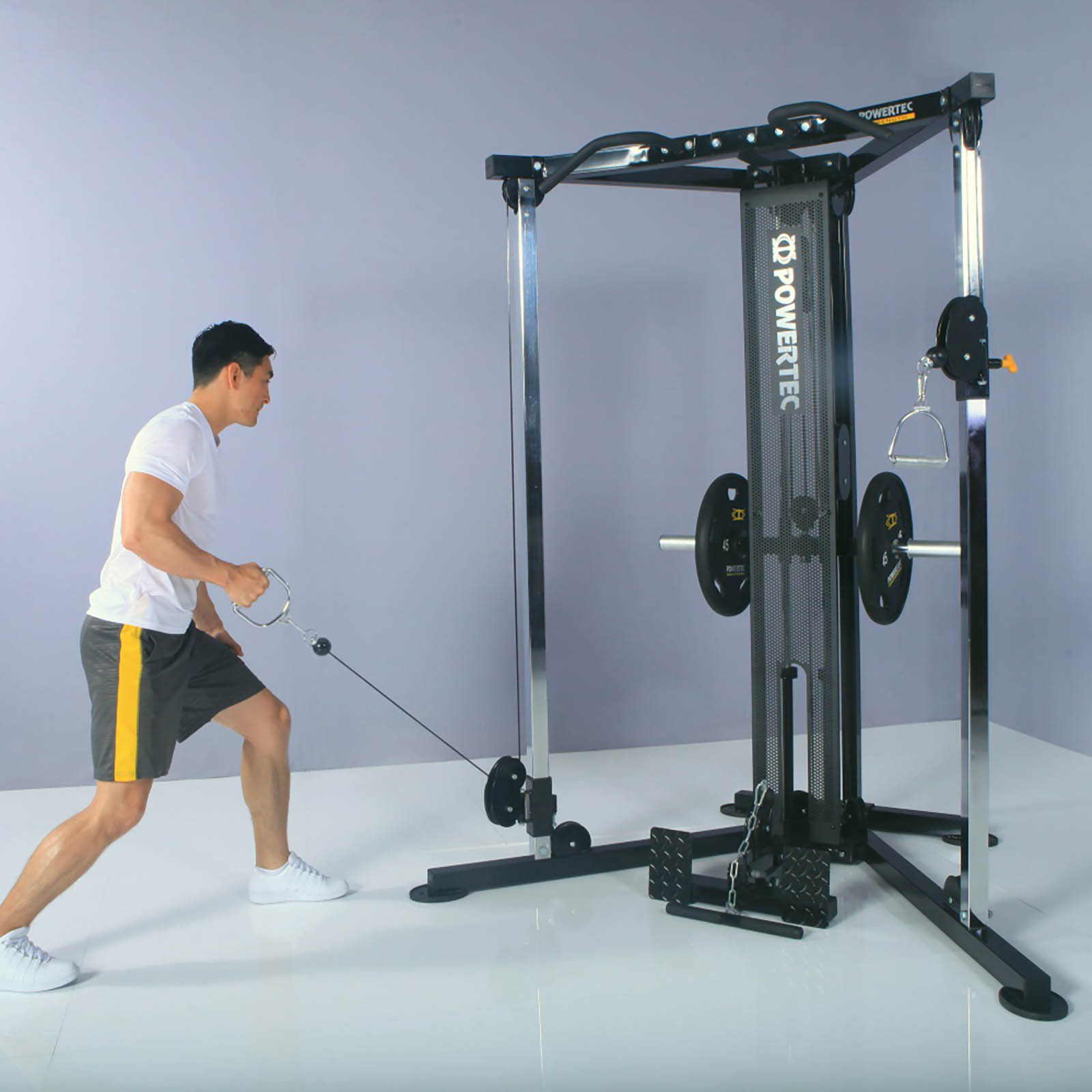 A man doing one arm rows on a functional trainer