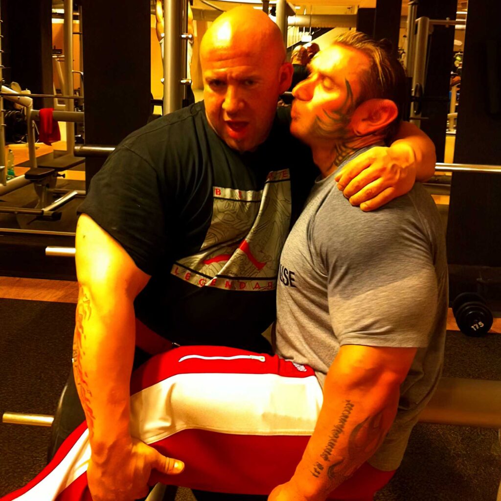 Lee Priest with another bodybuilder showing how to get growth in your physique