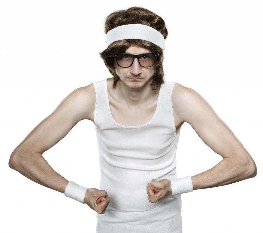Skinny dude flexing with very little muscle