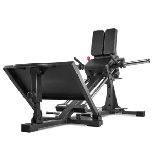 The ATX Compact Leg Press features a black sled leg press design with a padded backrest and foot platform. Its metal rails and adjustable weights are perfect for strength training, while the angled position highlights its sturdy construction and ergonomic design.