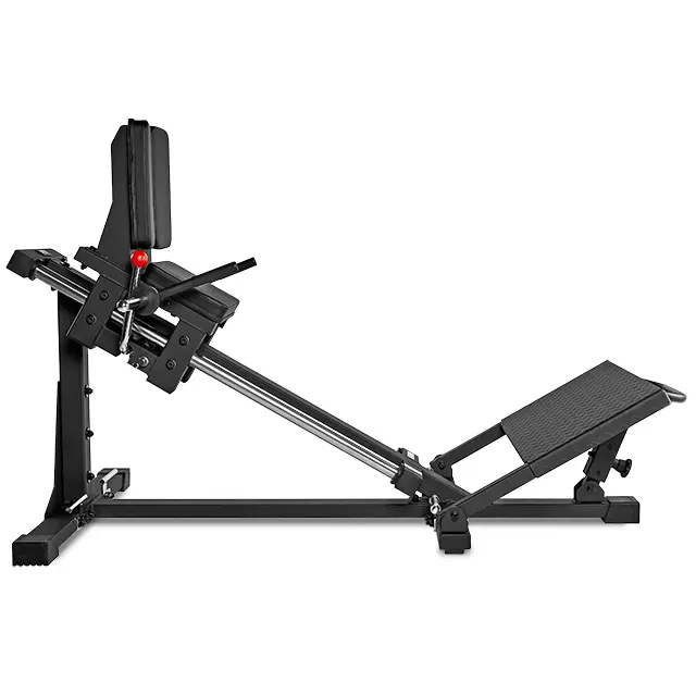 The ATX Compact Leg Press is a black machine with an inclined seat and adjustable backrest. It boasts a sturdy, angled frame featuring a footplate and weight carriage, perfect as a sled leg press for gym or home use.