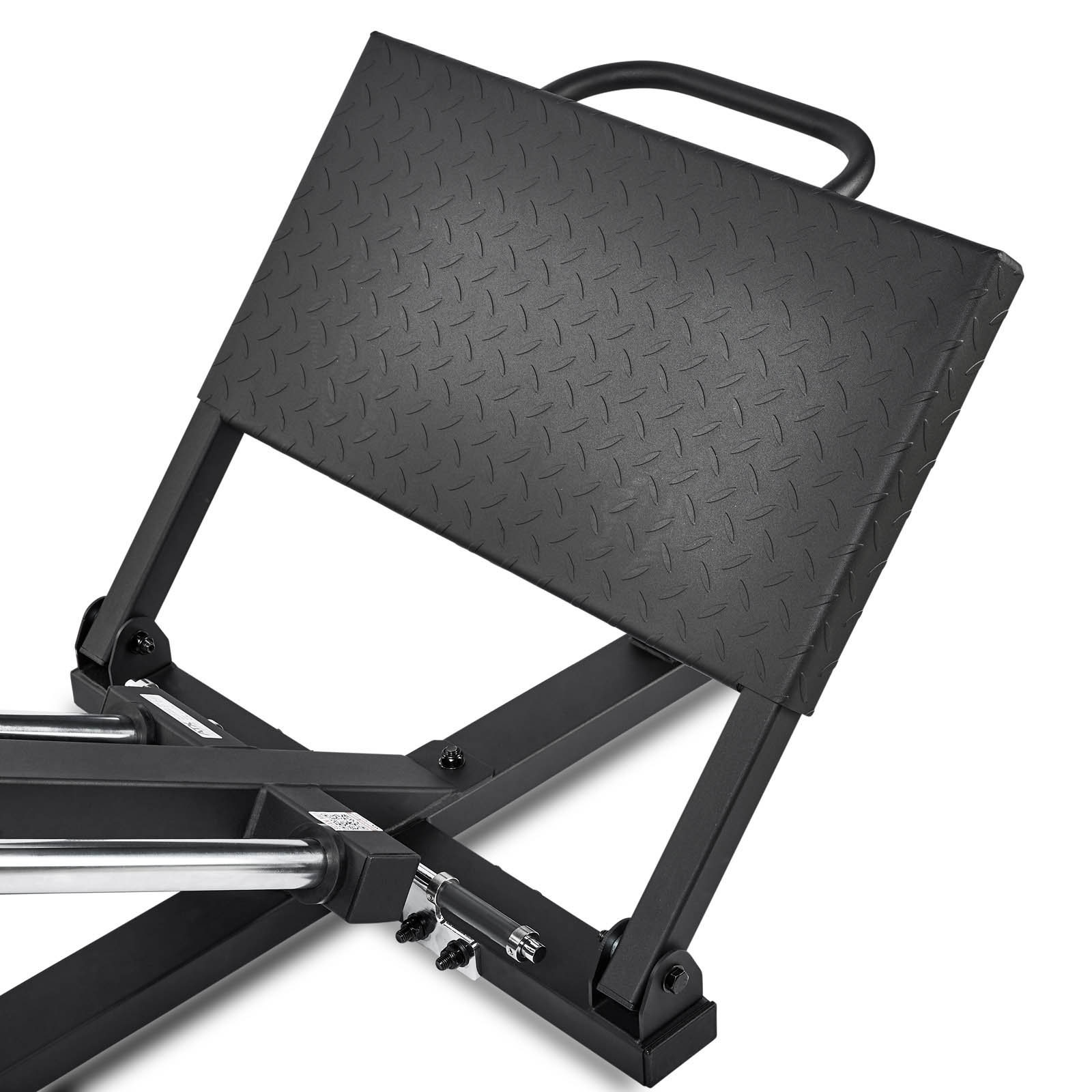 Close-up of a black, textured footplate attached to a metal frame on the ATX Compact Leg Press. The footplate has a diamond pattern, ideal for leg exercises. Two metal rods with adjustable settings are visible, embodying the precision of sled leg press equipment.