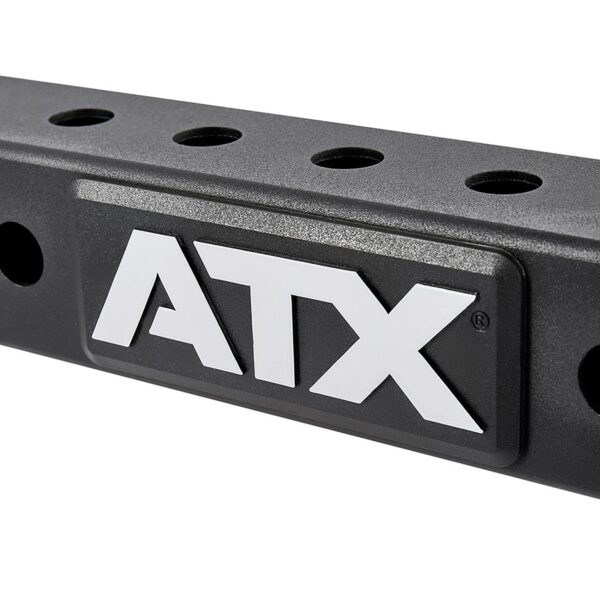A black metal bar with multiple circular holes and ATX® in bold white letters on a raised rectangular plaque. The surface has a textured finish.