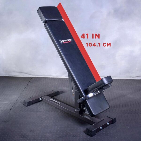 The Ironmaster Head Extension SB is an adjustable workout bench featuring a black padded surface, a sturdy metal frame, and a backrest angled at 41 inches (104.1 cm), placed on a textured floor against a plain backdrop.