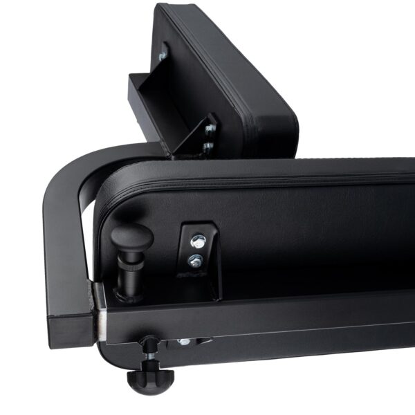 Close-up of the Ironmaster Seated Press Pad SB, a black adjustable workout bench featuring a padded seat and backrest with visible metal parts, bolts, and adjustment knobs, showcasing its robust construction designed for fitness use.