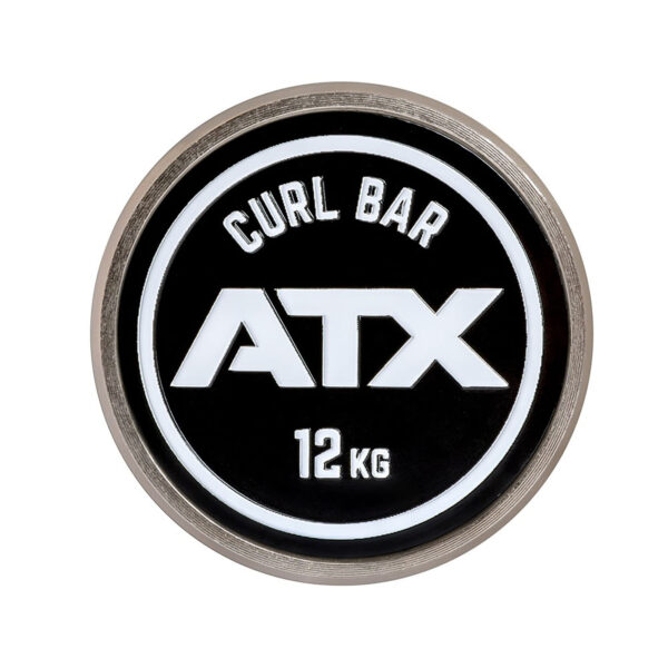 A close-up of a circular weightlifting plate shows the text ATX PRO Ez Curl Bar, 12 KG. The plate is black with white lettering and features a metallic edge.