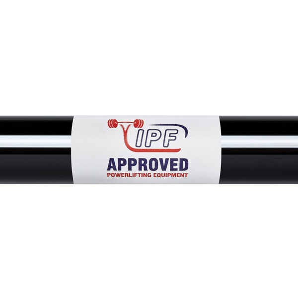 The ATX® Ram Powerlifting Bar II IPF features a black barbell with a white label displaying the IPF logo and a red weightlifting motif. Text on the label reads APPROVED POWERLIFTING EQUIPMENT in red and blue.