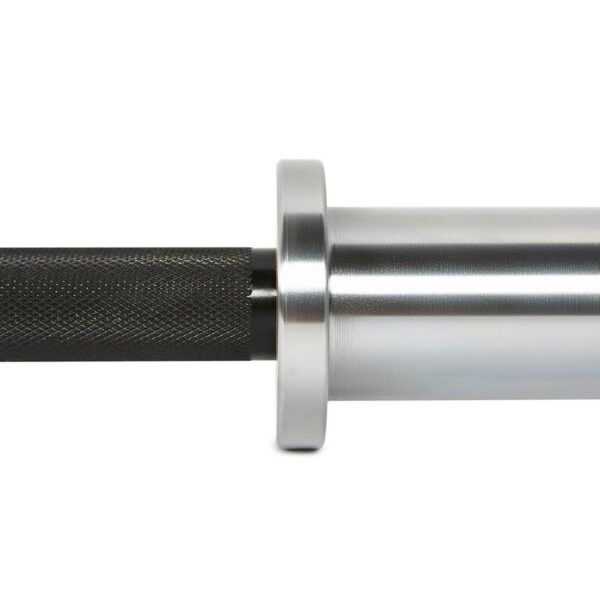 Close-up of the ATX® Ram Powerlifting Bar II IPFs metal sleeve and knurled grip, highlighting its sleek, shiny finish. The image captures the junction between the grip and sleeve for better handling.