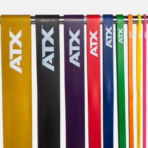 Seven ATX® Power Bands in yellow, black, purple, red, blue, green, and pink hang vertically from a rod.