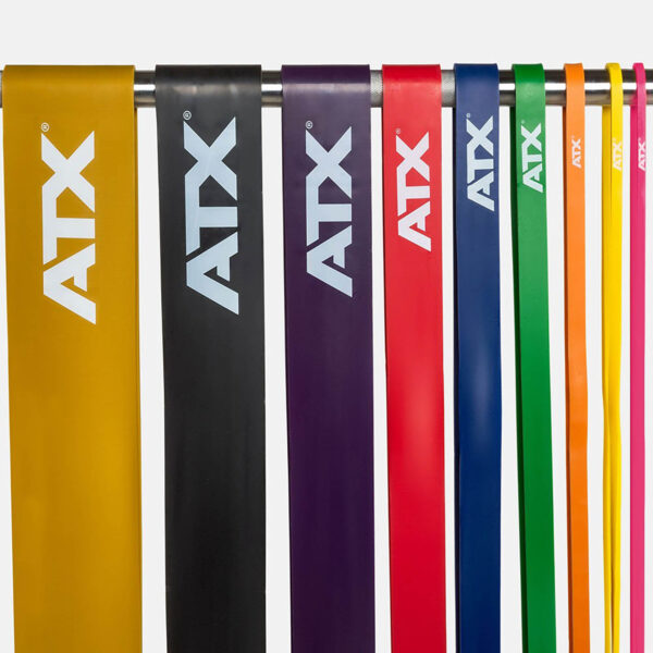Seven ATX® Power Bands in yellow, black, purple, red, blue, green, and pink hang vertically from a rod.