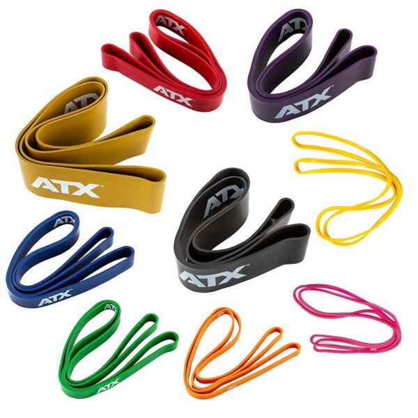 ATX® Power Bands, featuring the ATX logo, are arranged on a white background in a rainbow of colors including red, purple, yellow, black, blue, green, orange, and pink.