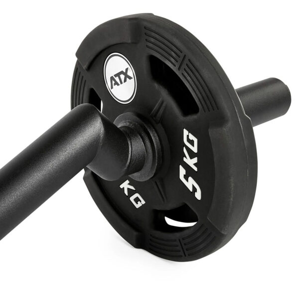 Close-up of a black FAT EZ Curl Bar weight plate labeled 5 KG, mounted on a barbell. The plate features cut-out handles for easy grip.