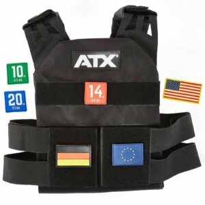 Surrounded by colorful 10 kg, 20 kg, and 14 kg weight plates, the ATX® Tactical Weight Vest in black features USA, Germany, and EU flag patches.